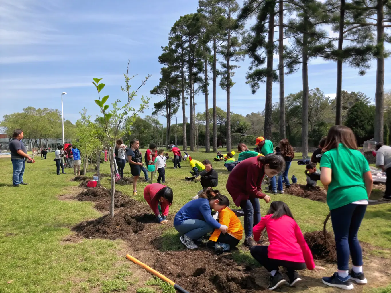 A photo of a community event with students, teachers, and local residents engaging in activities, representing the community engagement programs organized by OFFIC CENTR COOPER ECOLE LOIRE.